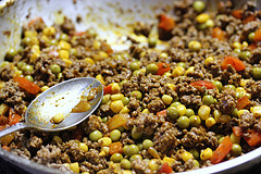 corn, peas, and peppers mixed with burger