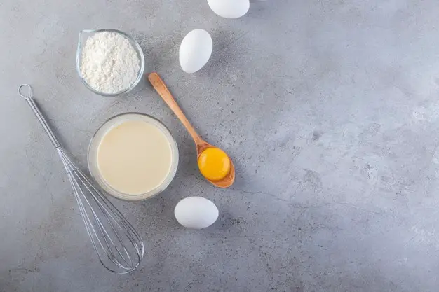 raw-fresh-white-chicken-eggs-with-milk-flour_2831-8628
