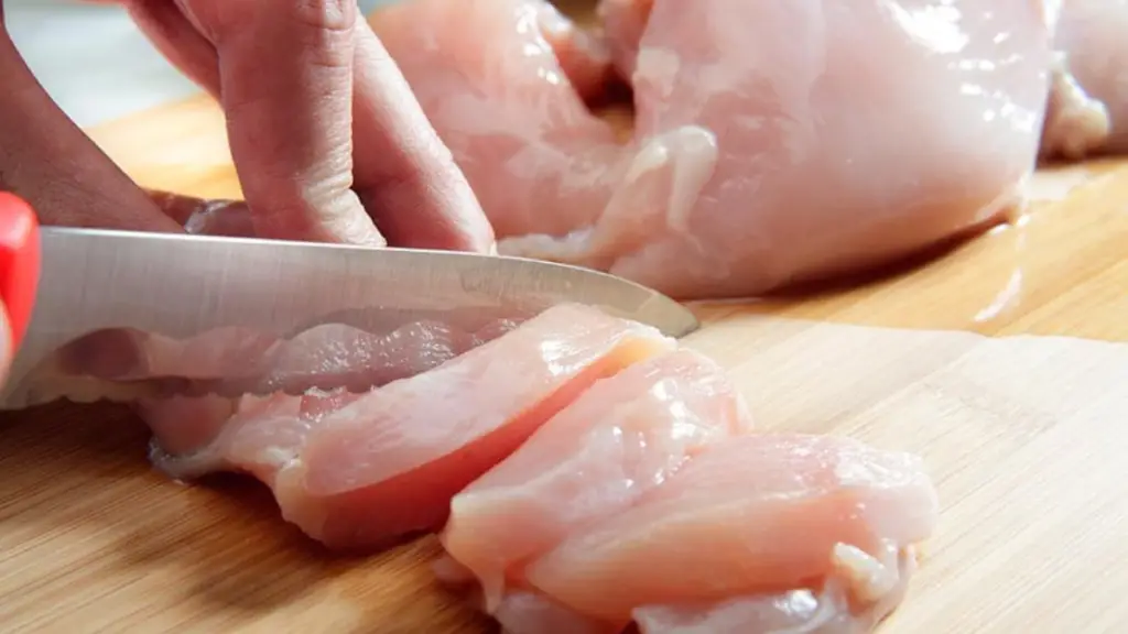 CUTTING OF CHICKEN BREAST WITH KNIFE